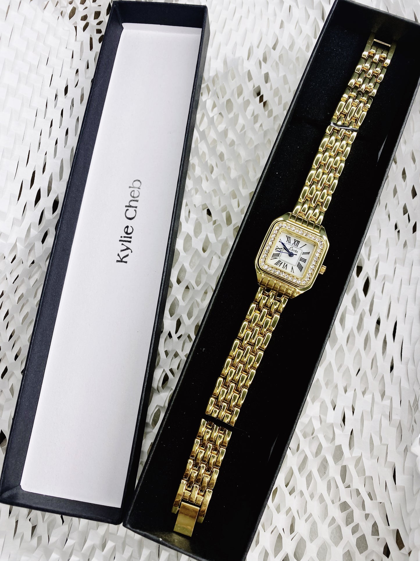Women’s gold Cartier crystal watch