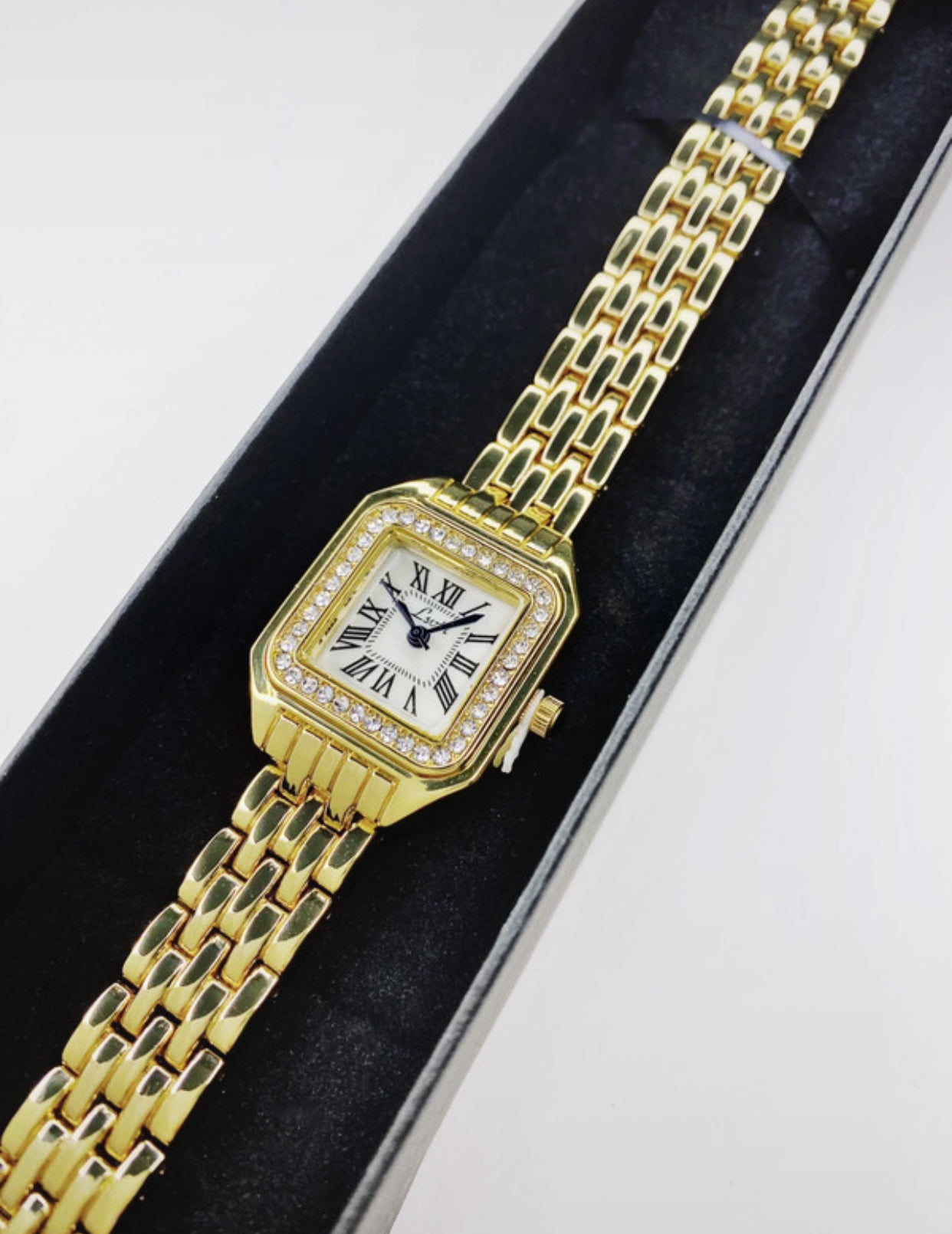 Gold square Cartier watch